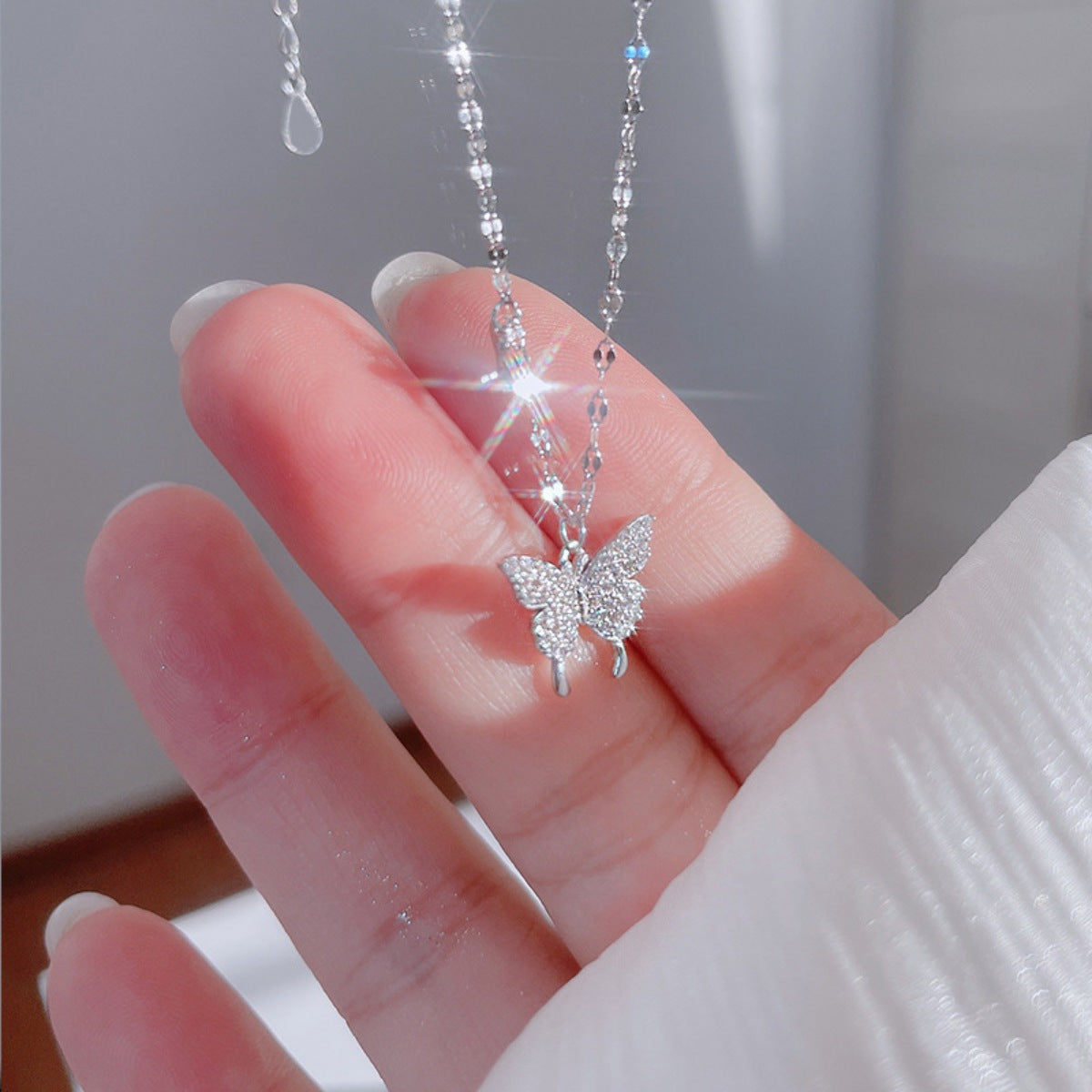 Sterling silver butterfly pendant necklace with zircon detail