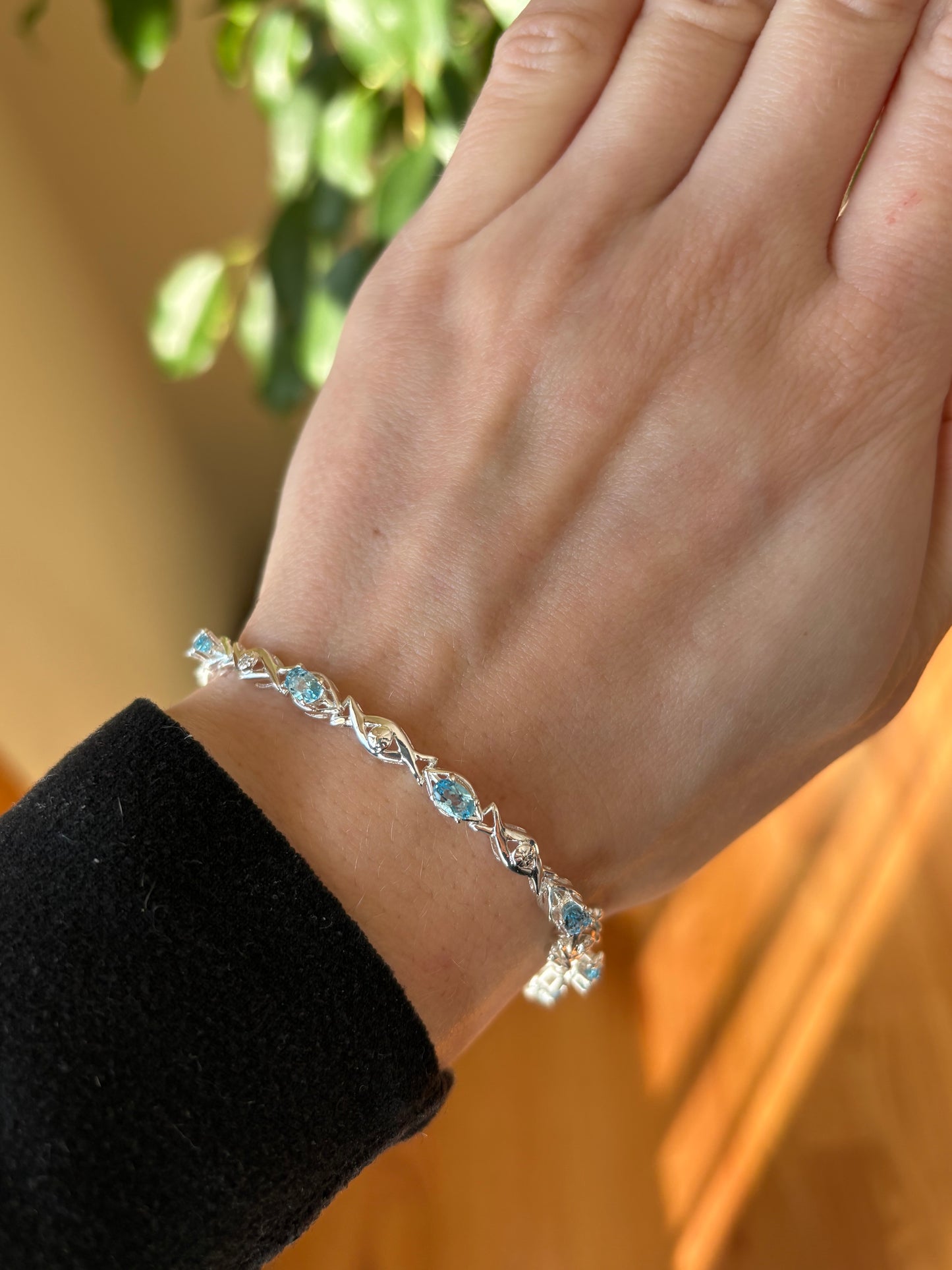 Sterling silver blue topaz bracelet from the Enchanted Crystals Collection featuring delicate light blue stones.