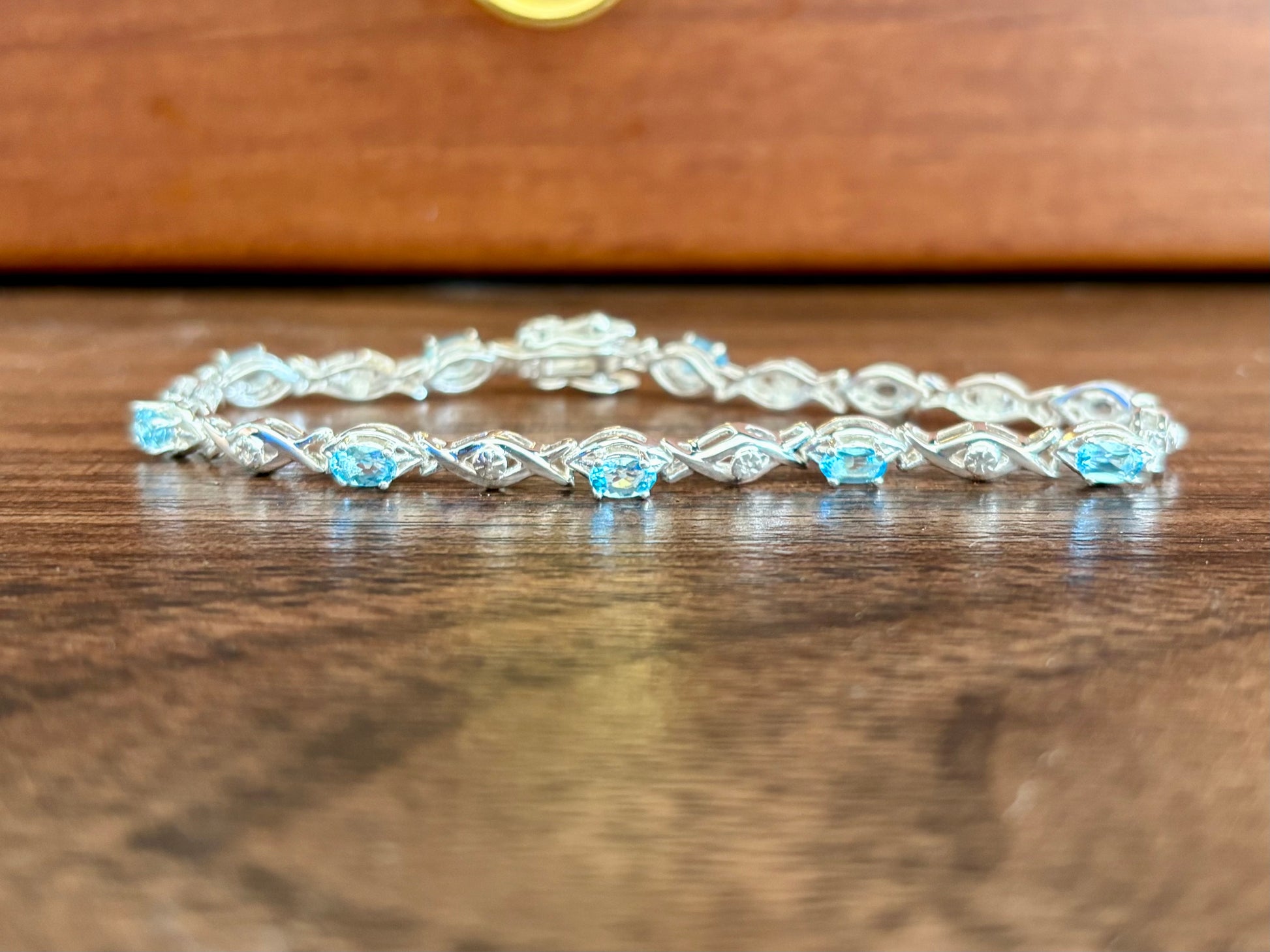 Sterling silver blue topaz bracelet from the Enchanted Crystals Collection featuring delicate light blue stones.
