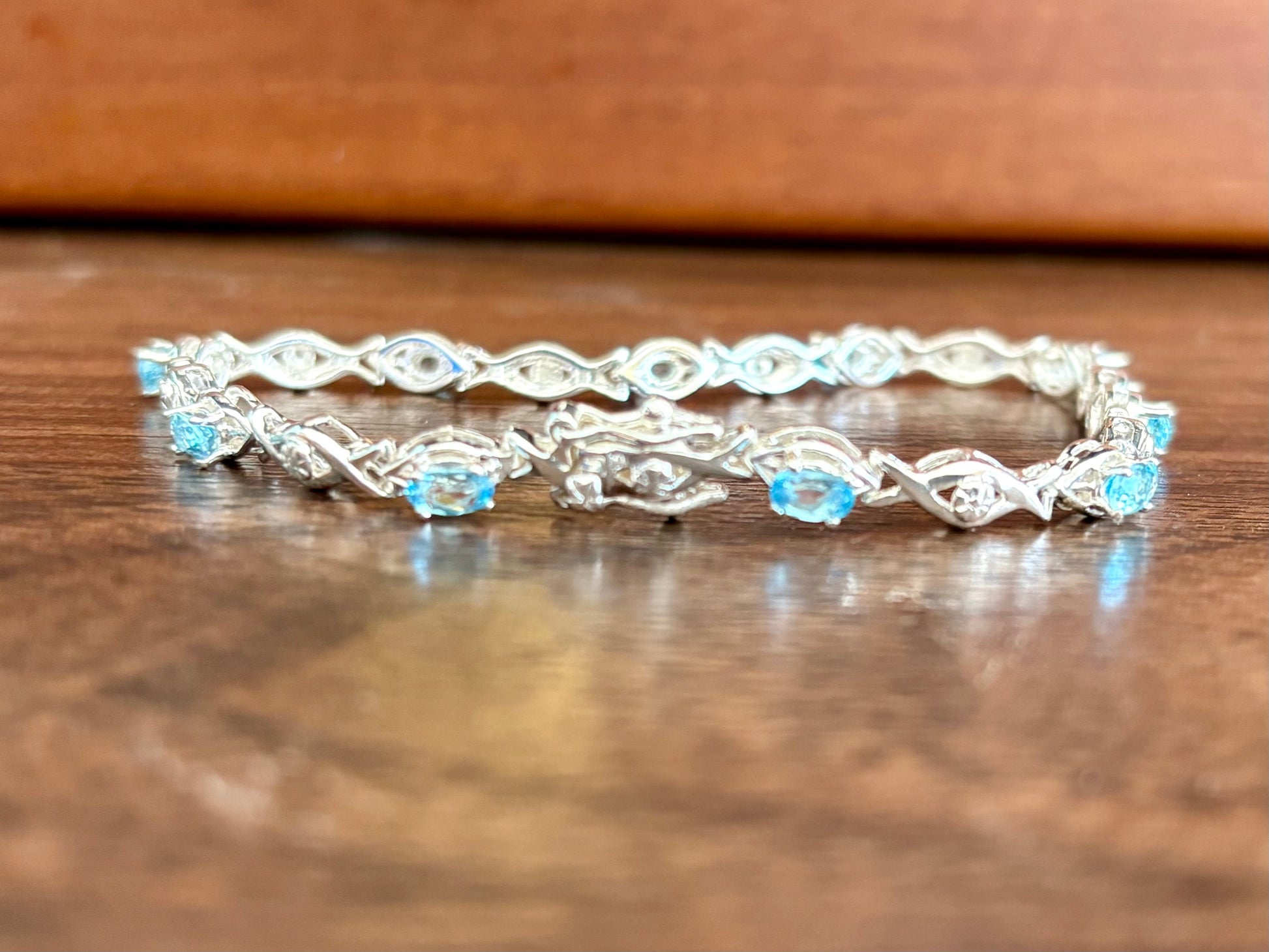 Sterling silver blue topaz bracelet from the Enchanted Crystals Collection featuring delicate light blue stones.
