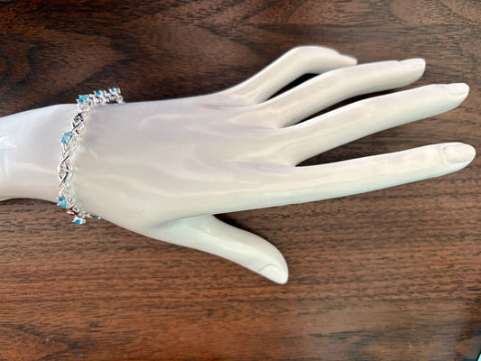 Sterling silver blue topaz bracelet from the Enchanted Crystals Collection featuring delicate light blue stones.