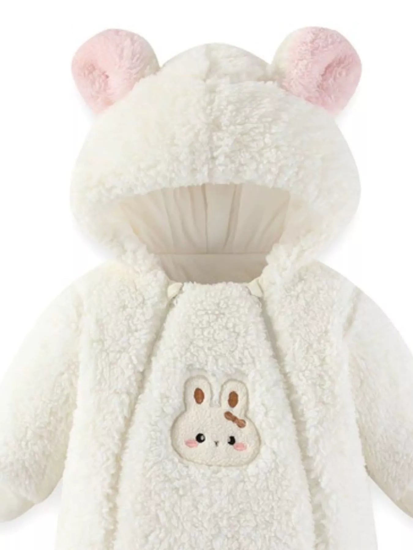 White plush baby hooded romper with bunny ears and soft fleece texture