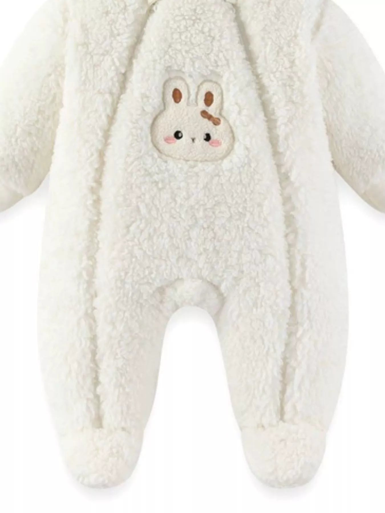 White plush baby hooded romper with bunny ears and soft fleece texture