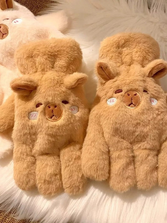 Pair of fluffy lamb-shaped plush gloves in soft neutral tones, cozy and cute winter handwear