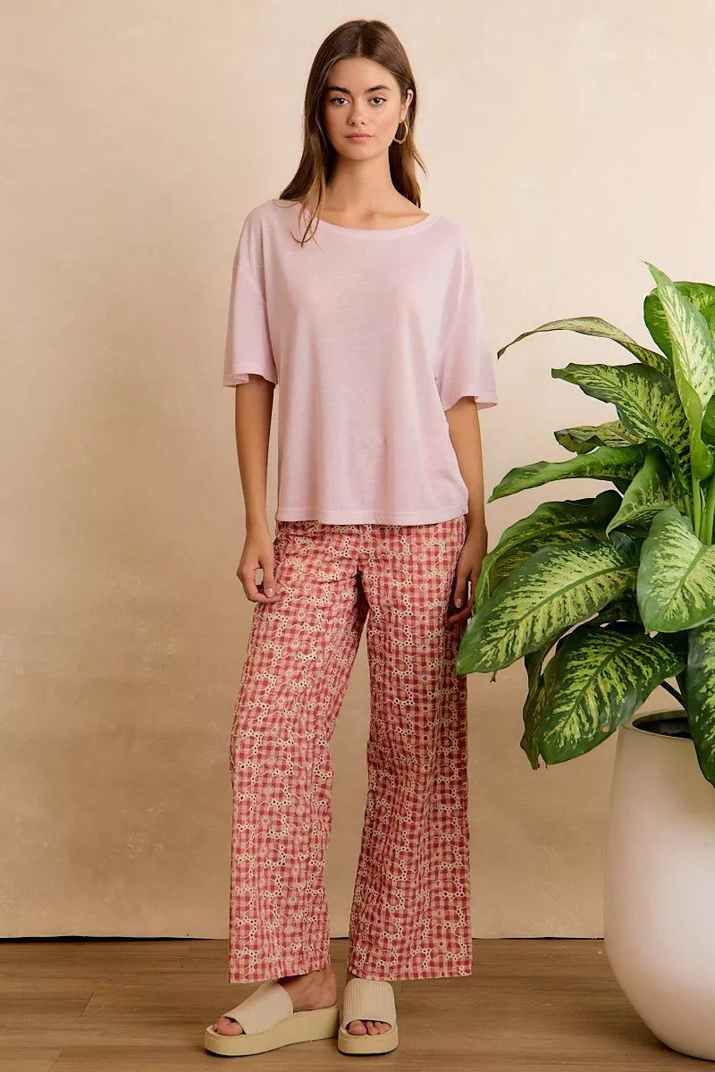 Lightweight oversized short sleeve tee with a sheer finish, front pocket detail, and relaxed slightly stretchy fit styled with printed pants.