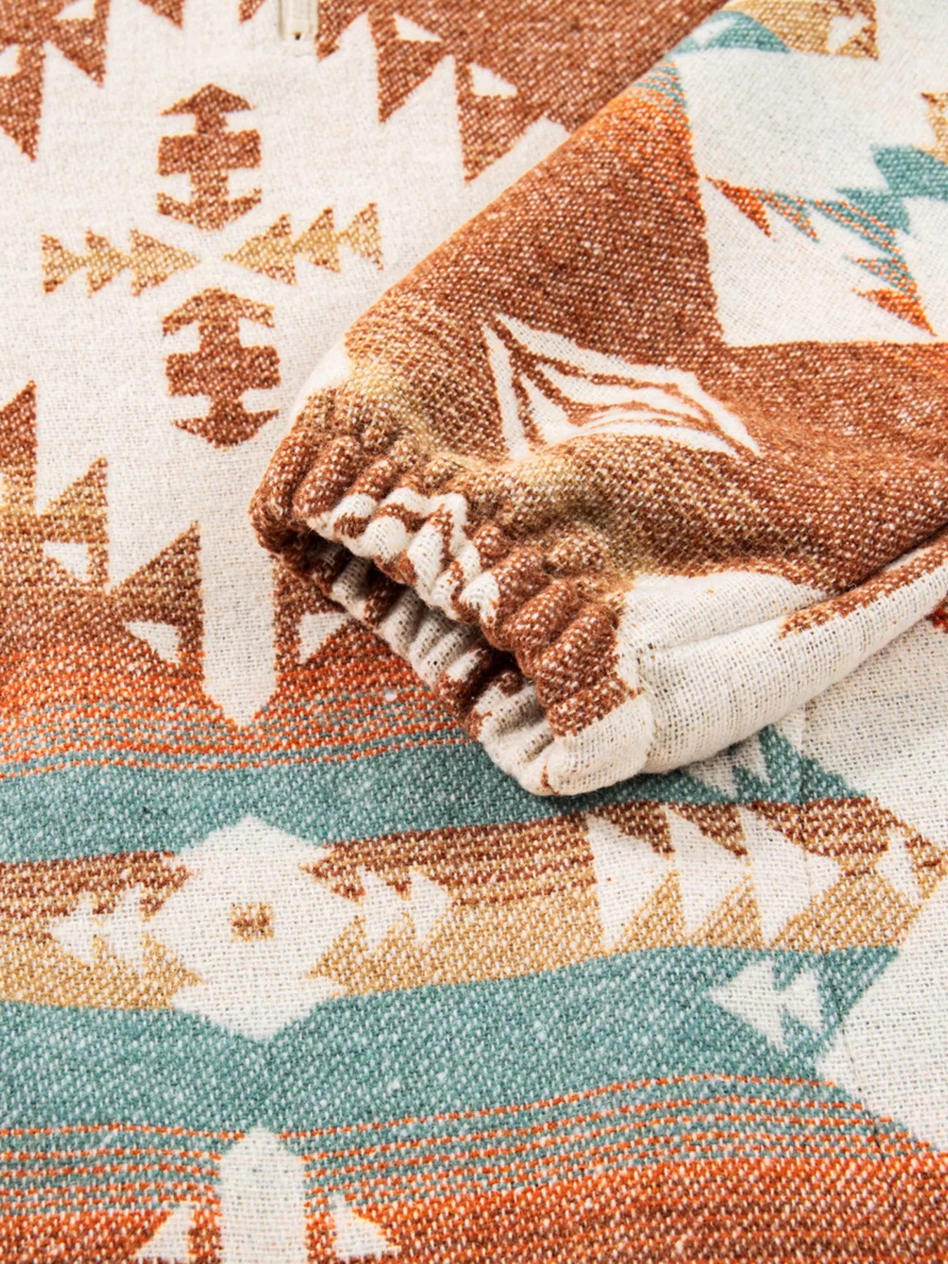 Camel Aztec print quarter zip sweatshirt with elastic cuffs.