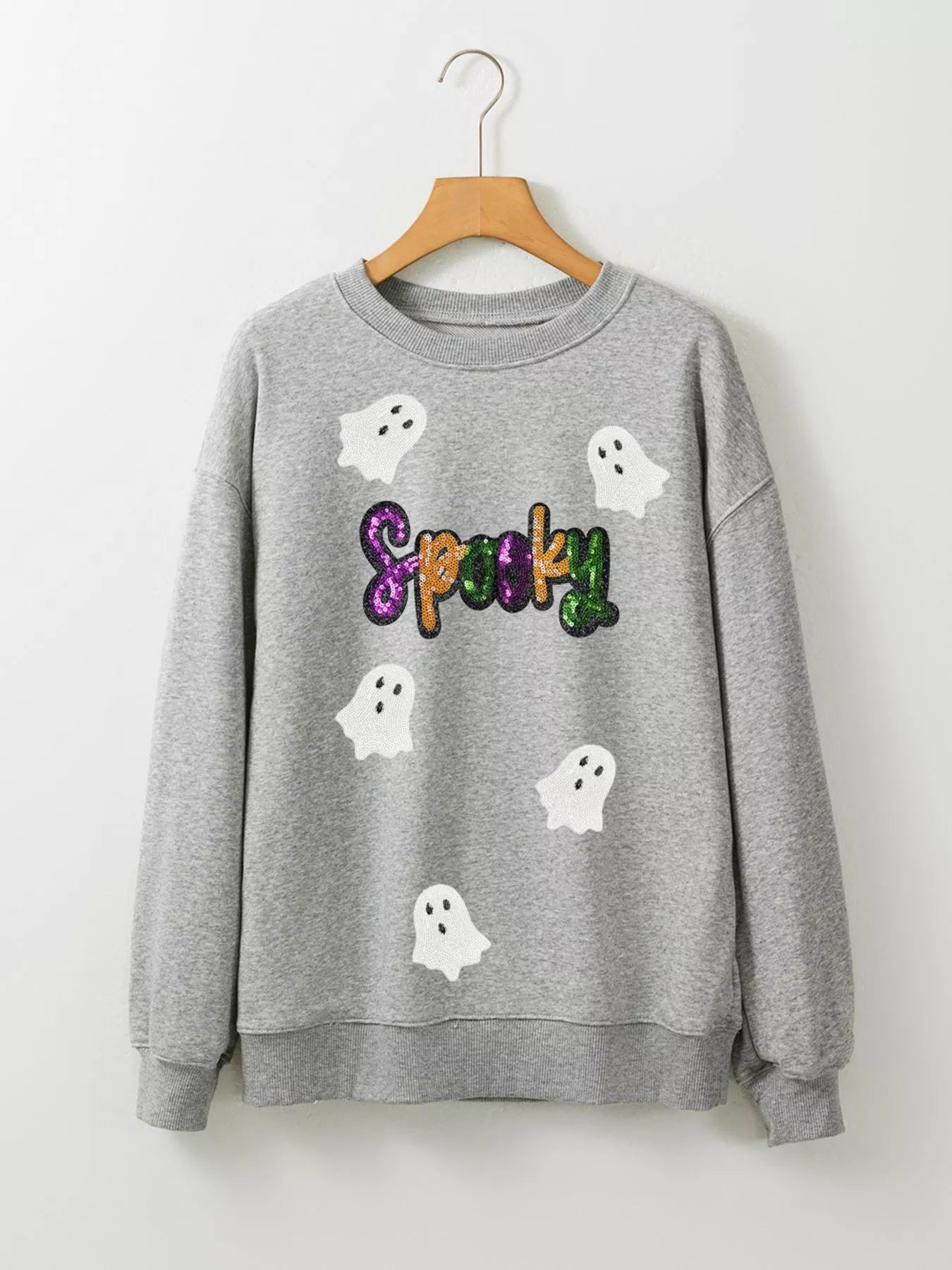 Grey Halloween sweatshirt with white ghosts and colorful sequin “SPOOKY” lettering – Sparkle Spooky style from A Whimsical Affair.
