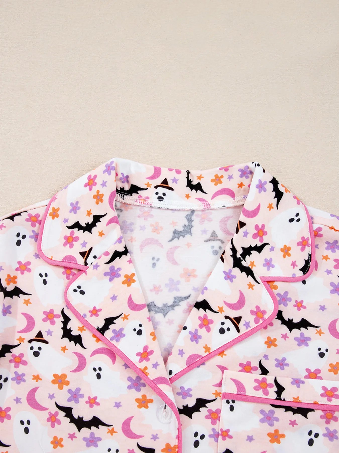 Halloween ghost print two-piece lounge set with button-up top and pants – Spooky Comfort style from A Whimsical Affair.