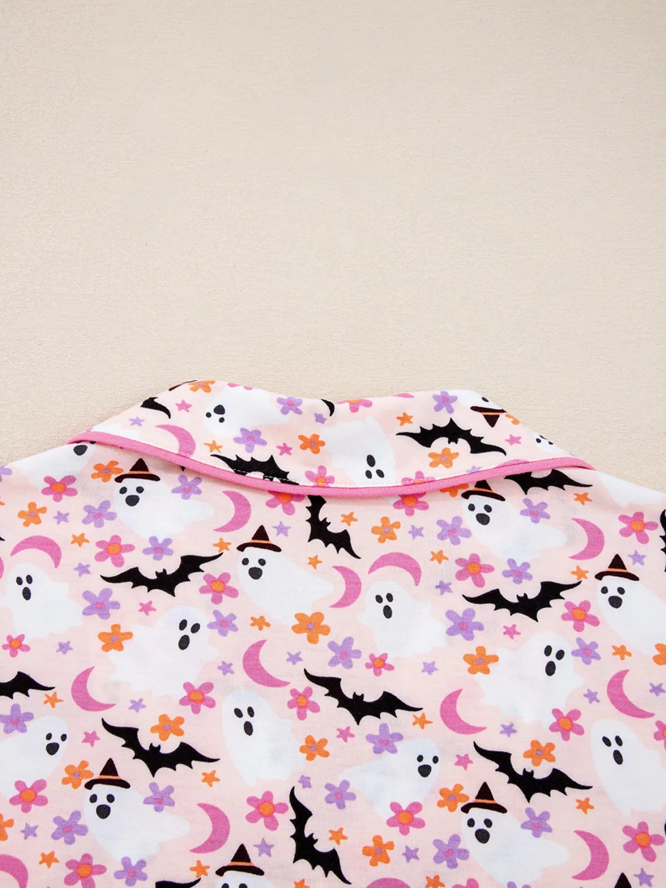 Halloween ghost print two-piece lounge set with button-up top and pants – Spooky Comfort style from A Whimsical Affair.