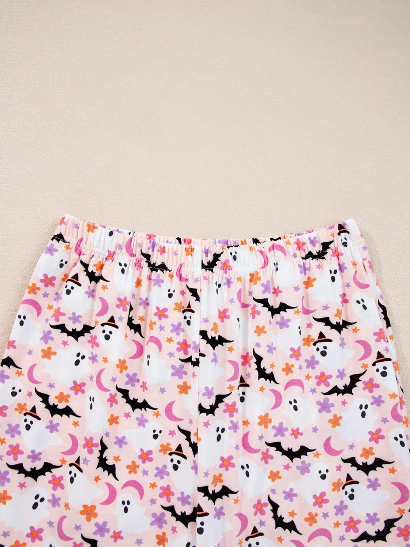 Halloween ghost print two-piece lounge set with button-up top and pants – Spooky Comfort style from A Whimsical Affair.