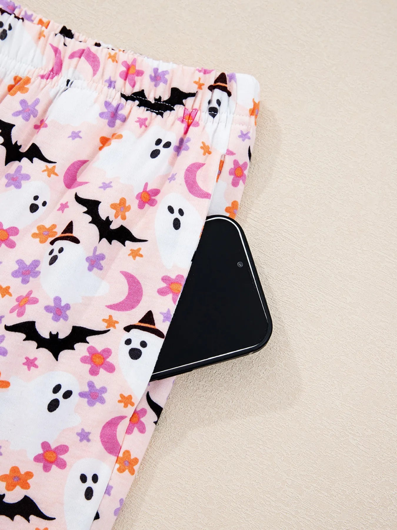 Halloween ghost print two-piece lounge set with button-up top and pants – Spooky Comfort style from A Whimsical Affair.