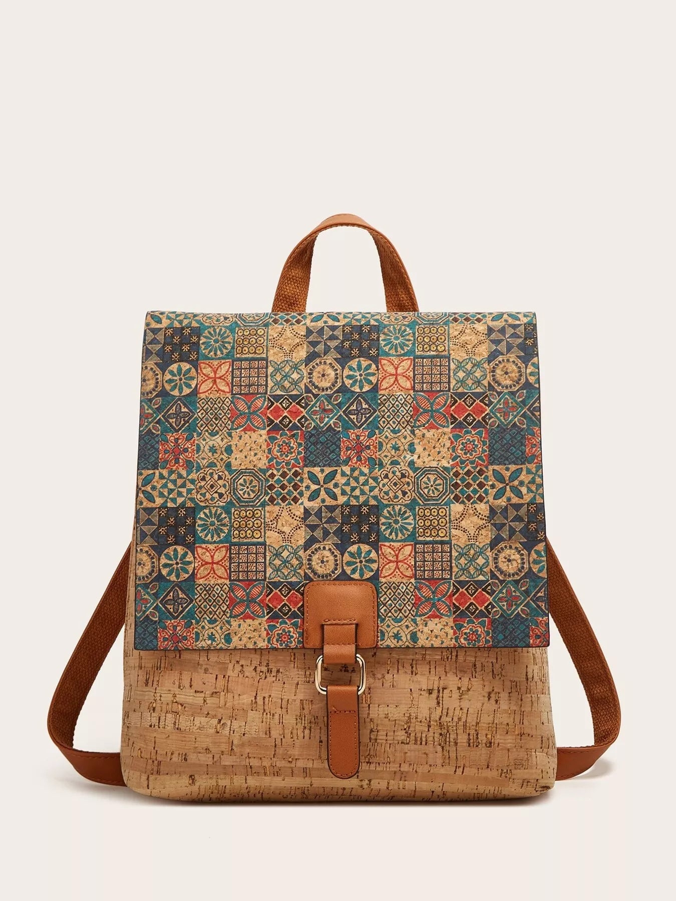 Backpack with a patterned top section and cork base on a white background