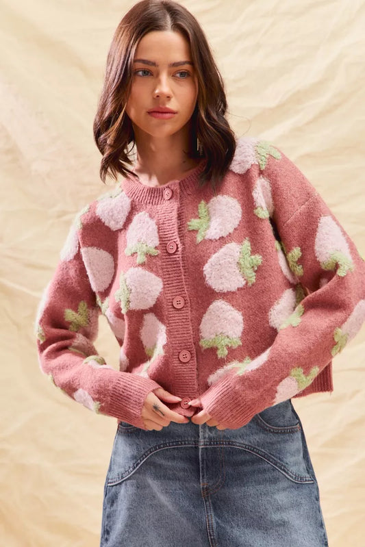Model wearing pink strawberry button cardigan, cottagecore knit outfit for fall.