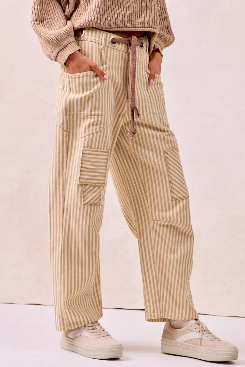 Beige and cream striped barrel leg pants with drawstring waist and patch pockets