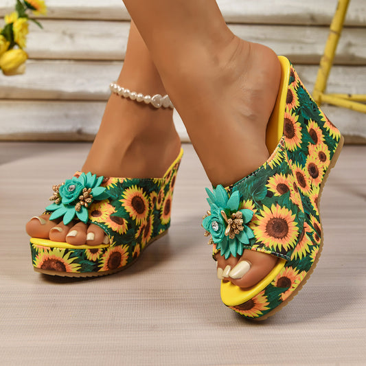 Woman wearing sunflower print wedge sandals with floral embellishment