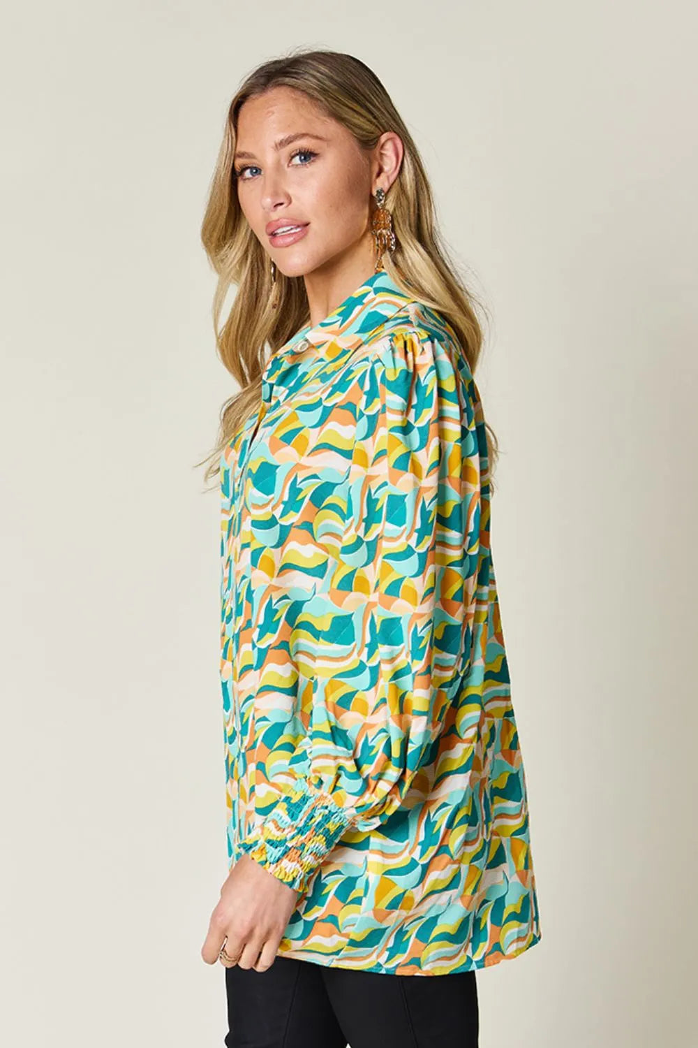 Abstract print blouse with smocked cuffs and long sleeves