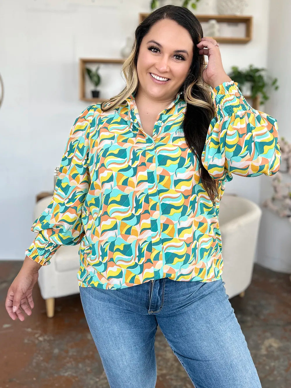 Abstract print blouse with smocked cuffs and long sleeves