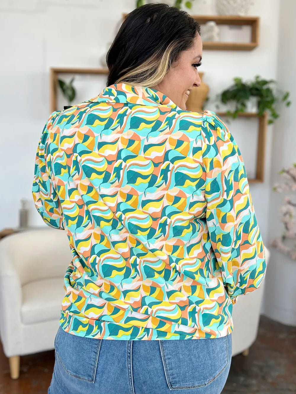 Abstract print blouse with smocked cuffs and long sleeves