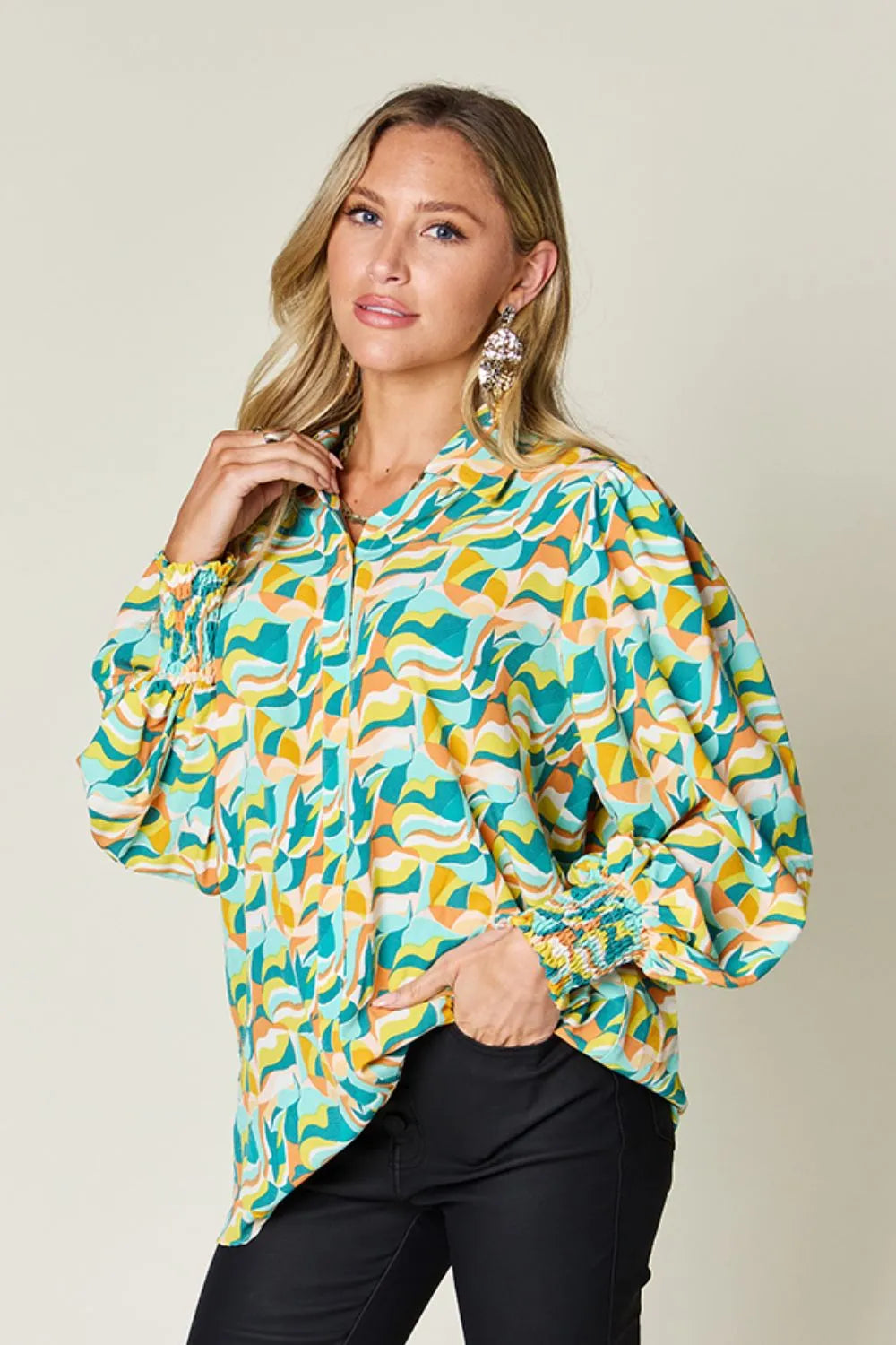 Abstract print blouse with smocked cuffs and long sleeves