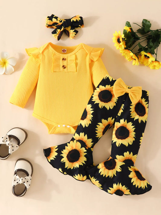 Baby outfit featuring a yellow ruffled romper, sunflower bell-bottom pants, and matching sunflower bow headband displayed flat with floral accents.