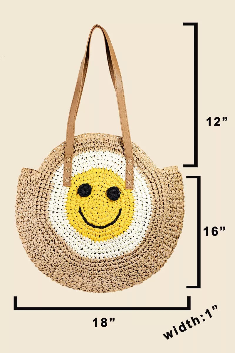 Round straw tote bag with braided design and happy face motif.