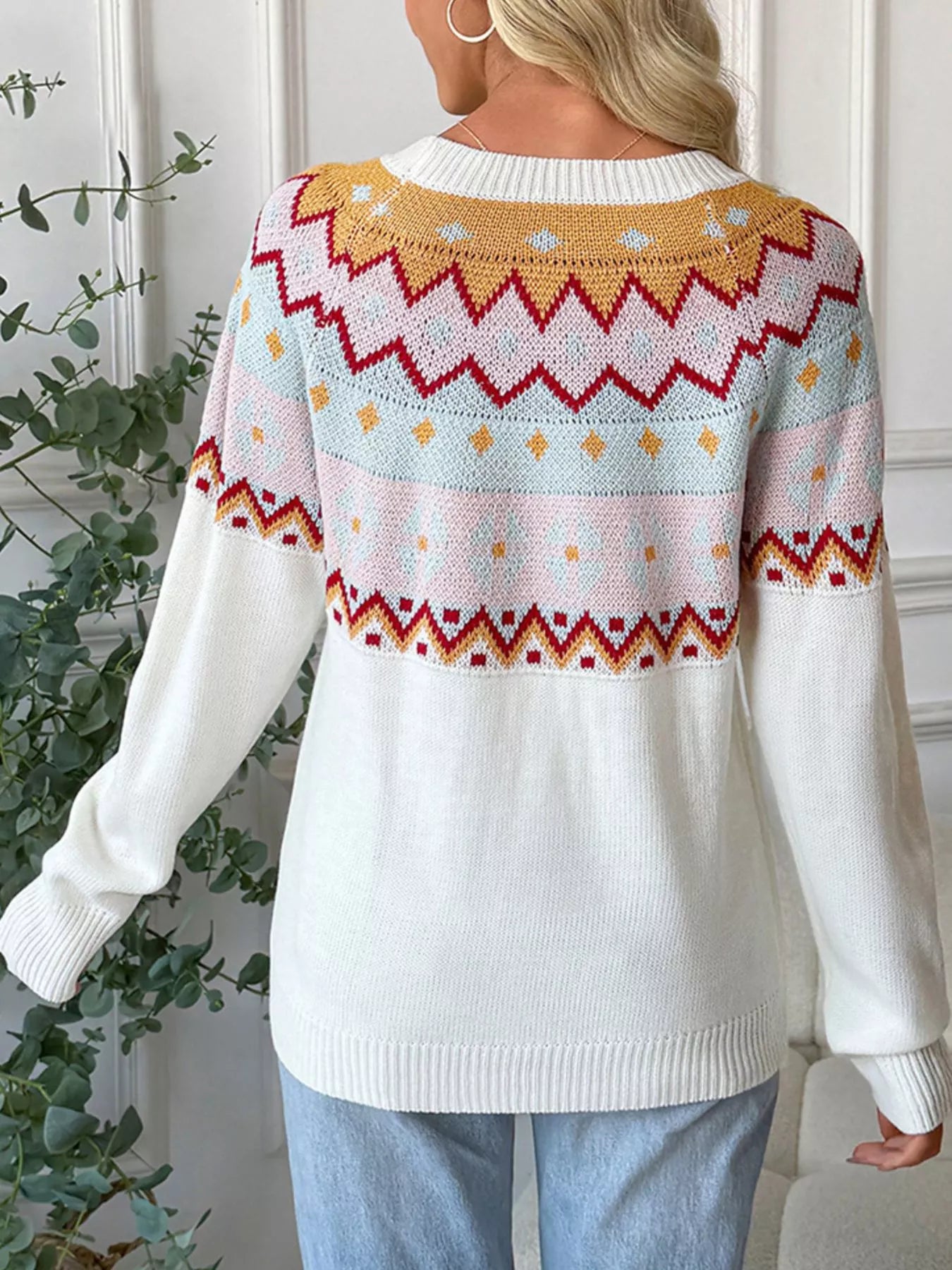 Cream Fair Isle sweater with colorful knit pattern in mustard, burgundy, and blush tones