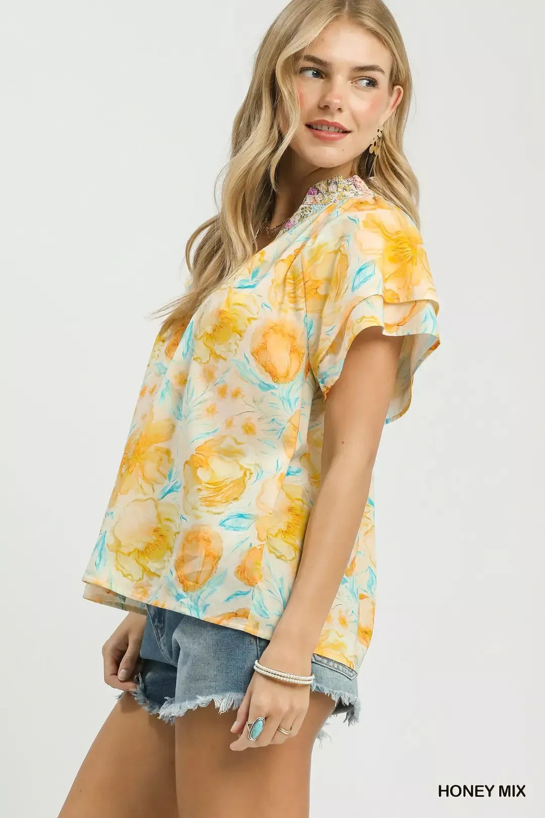 pastel floral ruffle sleeve blouse with yellow and blue watercolor flowers in a romantic boho style