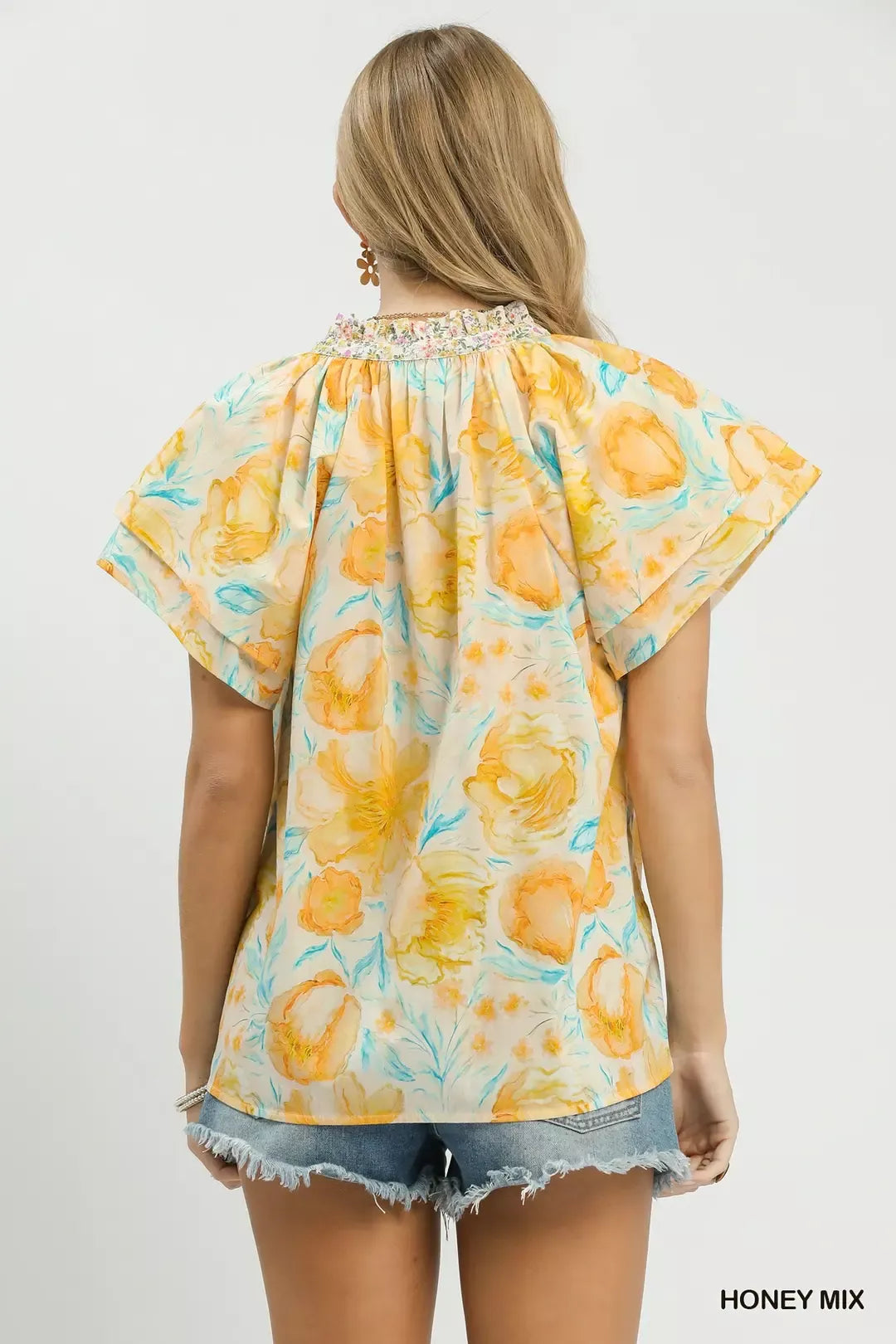 pastel floral ruffle sleeve blouse with yellow and blue watercolor flowers in a romantic boho style