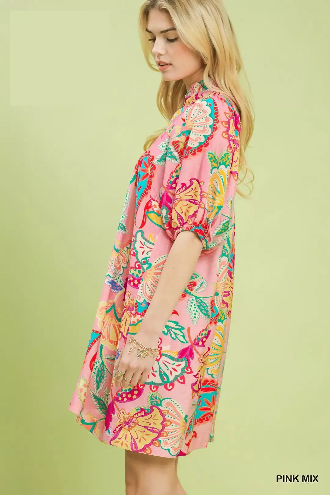 flowy pink boho mini dress with colorful floral paisley print and relaxed whimsical summer silhouette
