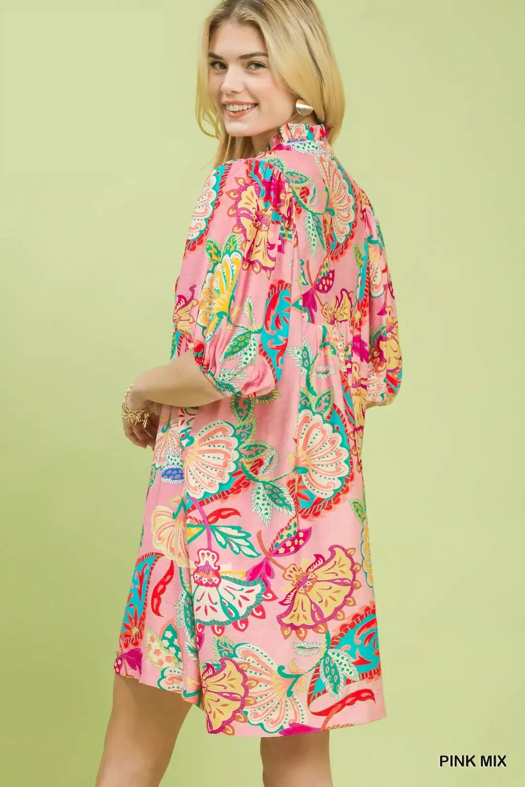 flowy pink boho mini dress with colorful floral paisley print and relaxed whimsical summer silhouette