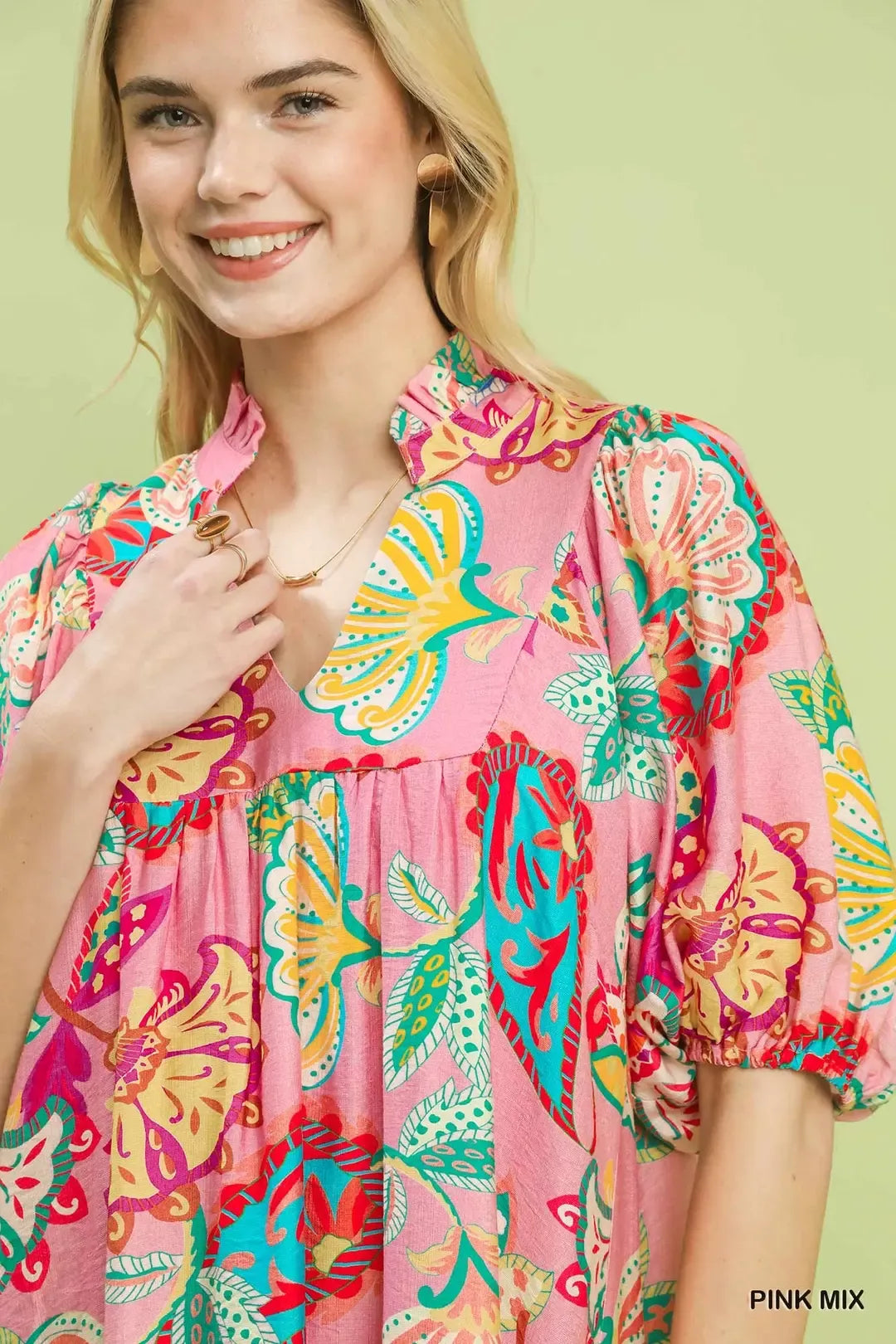 flowy pink boho mini dress with colorful floral paisley print and relaxed whimsical summer silhouette