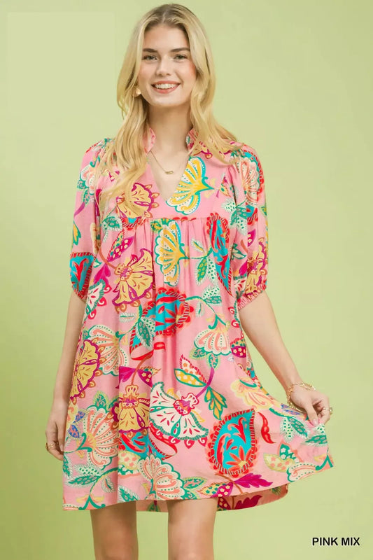 flowy pink boho mini dress with colorful floral paisley print and relaxed whimsical summer silhouette