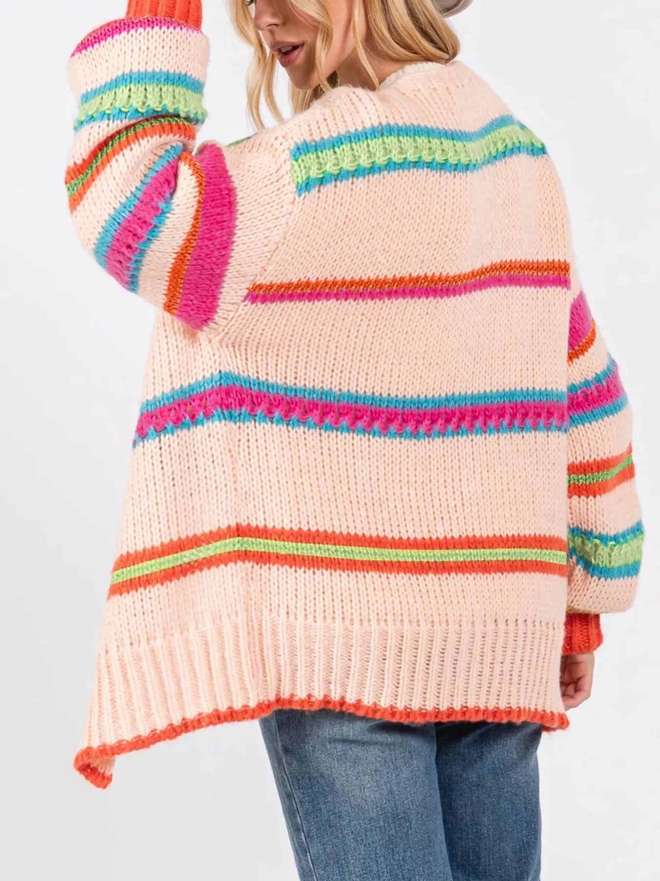 Multicolor striped knit cardigan with ribbed cuffs styled over a white tank and jeans