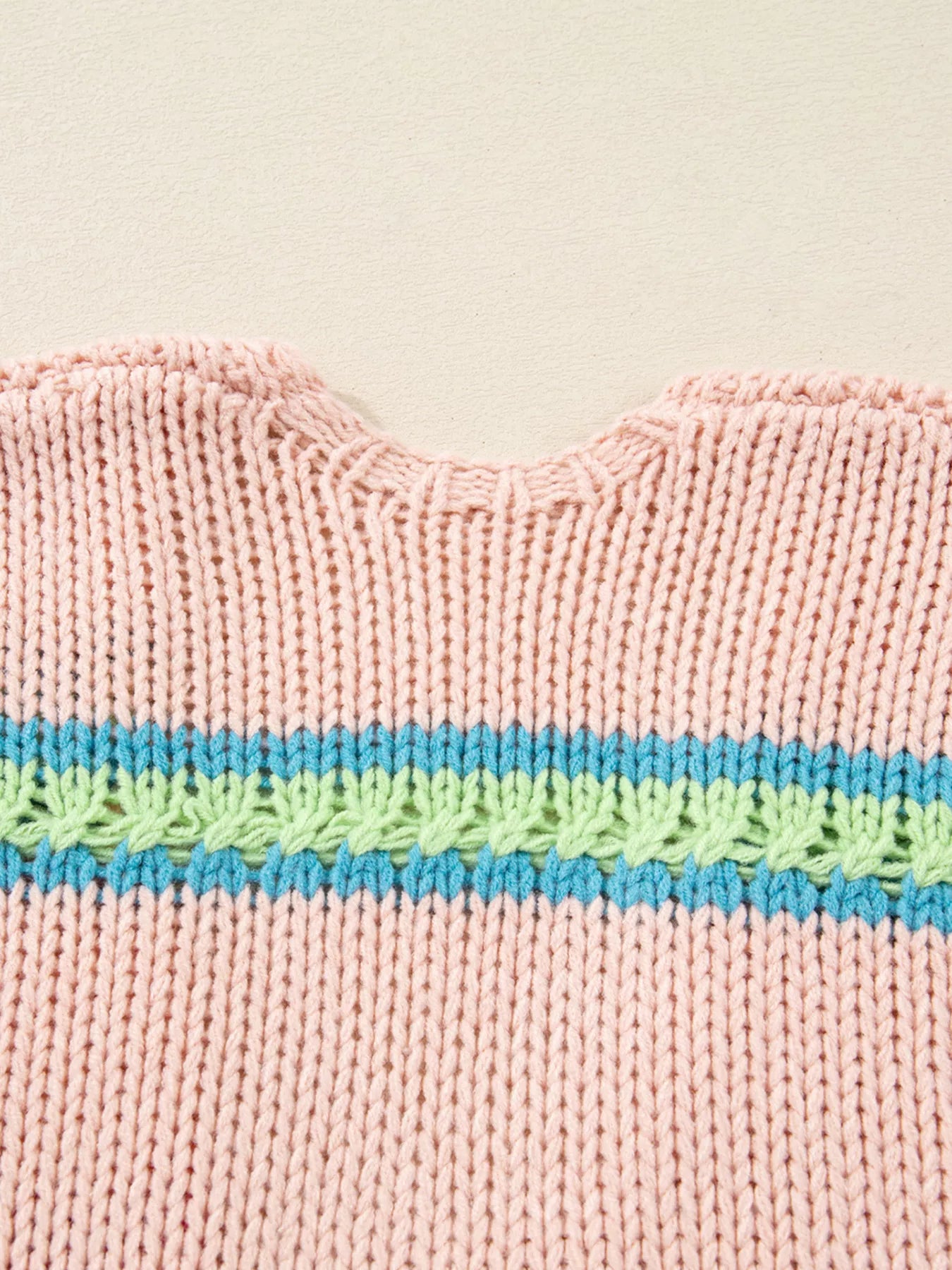 Multicolor striped knit cardigan with ribbed cuffs styled over a white tank and jeans
