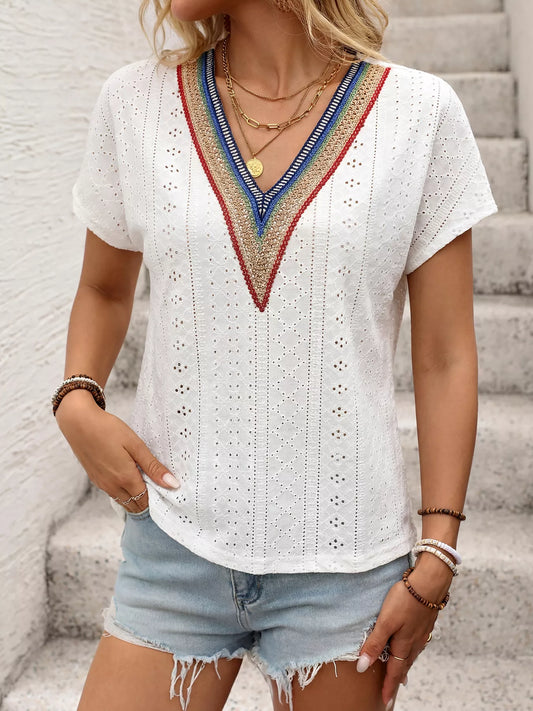 White eyelet short sleeve top with multicolor embroidered V-neck