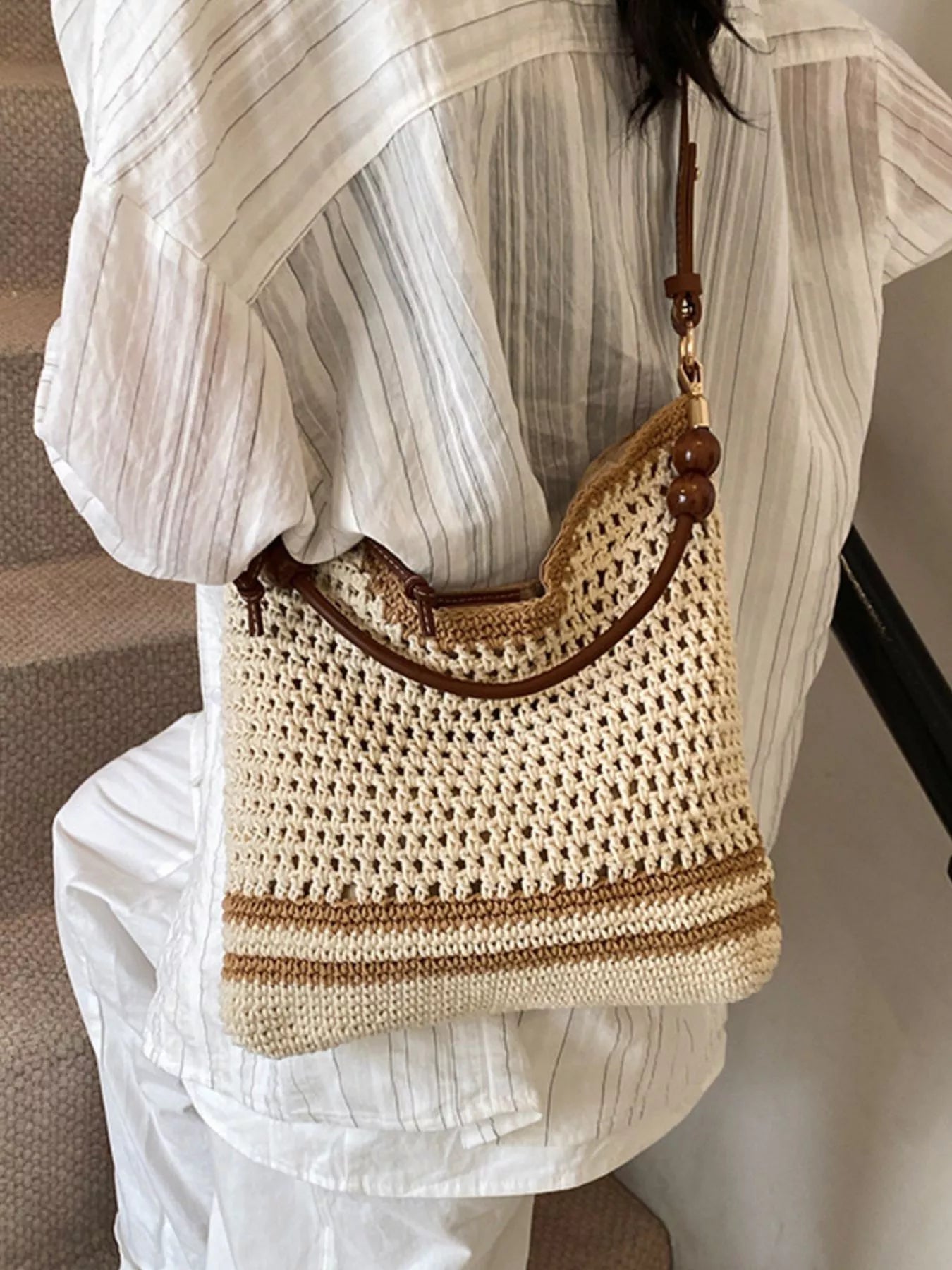 Medium woven boho shoulder bag with crochet-style texture, beaded accents, brown strap details, and lightweight polyester material.