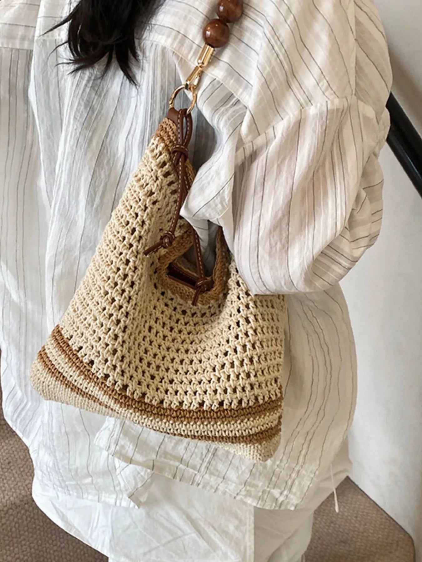 Medium woven boho shoulder bag with crochet-style texture, beaded accents, brown strap details, and lightweight polyester material.