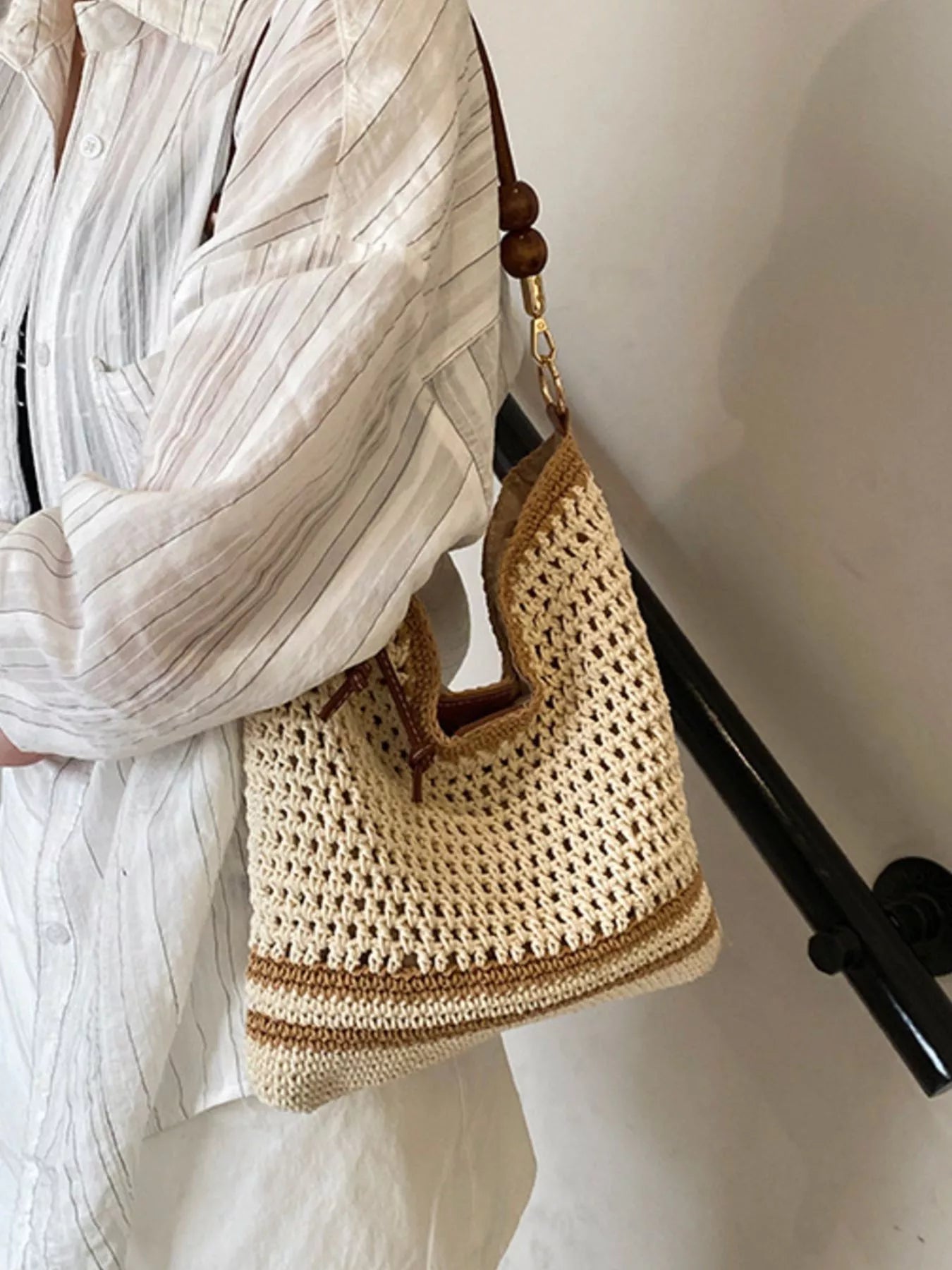 Medium woven boho shoulder bag with crochet-style texture, beaded accents, brown strap details, and lightweight polyester material.