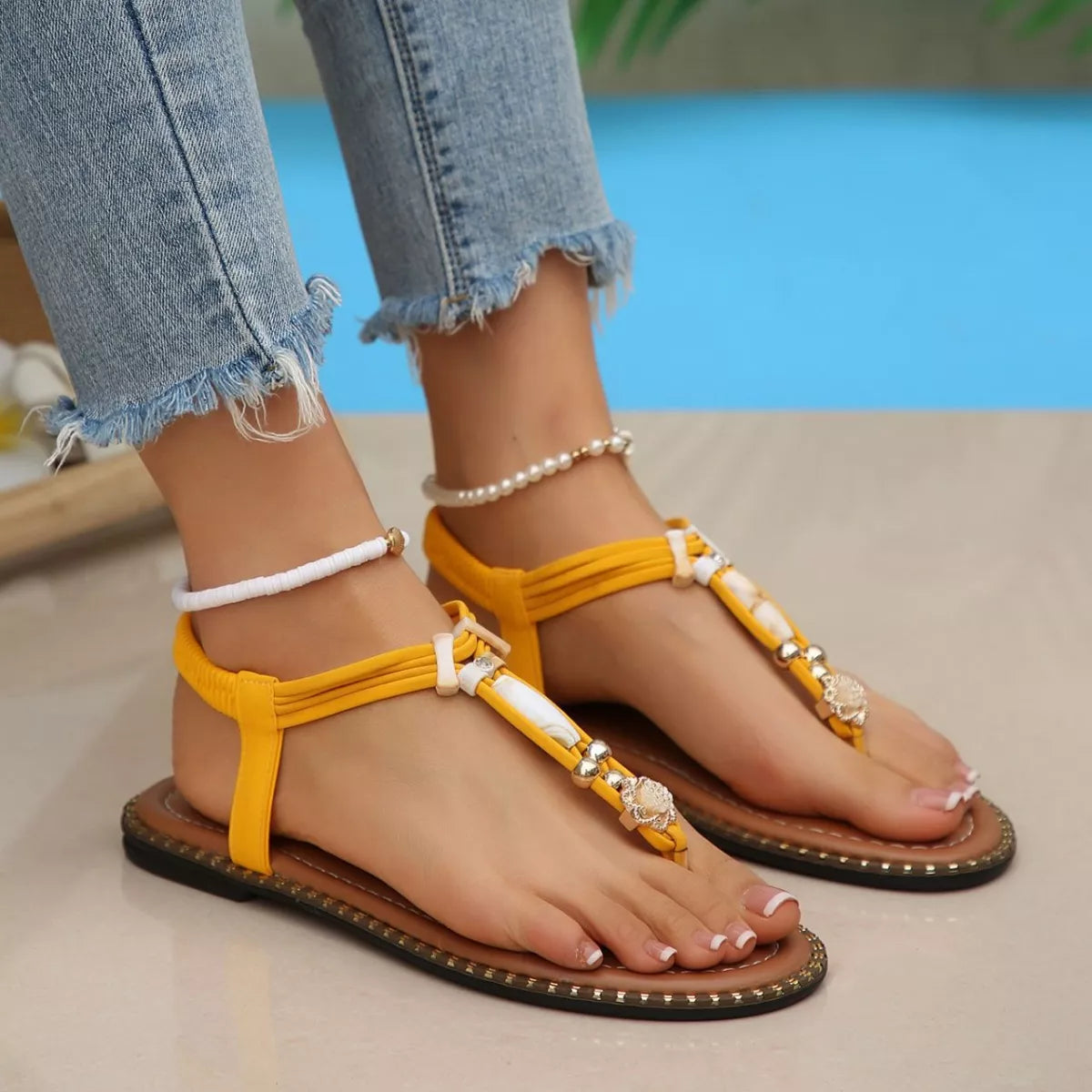 colorful woven boho sandals with bead accents and flat sole