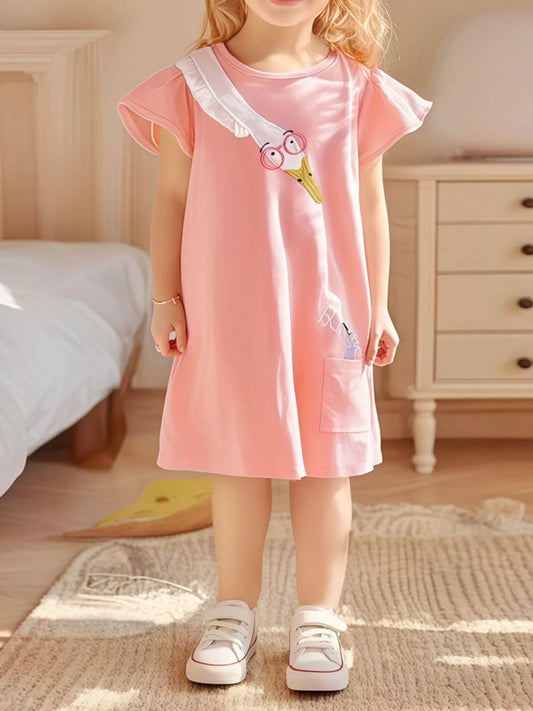 Pink girls dress with flutter sleeves and playful bird detail styled indoors