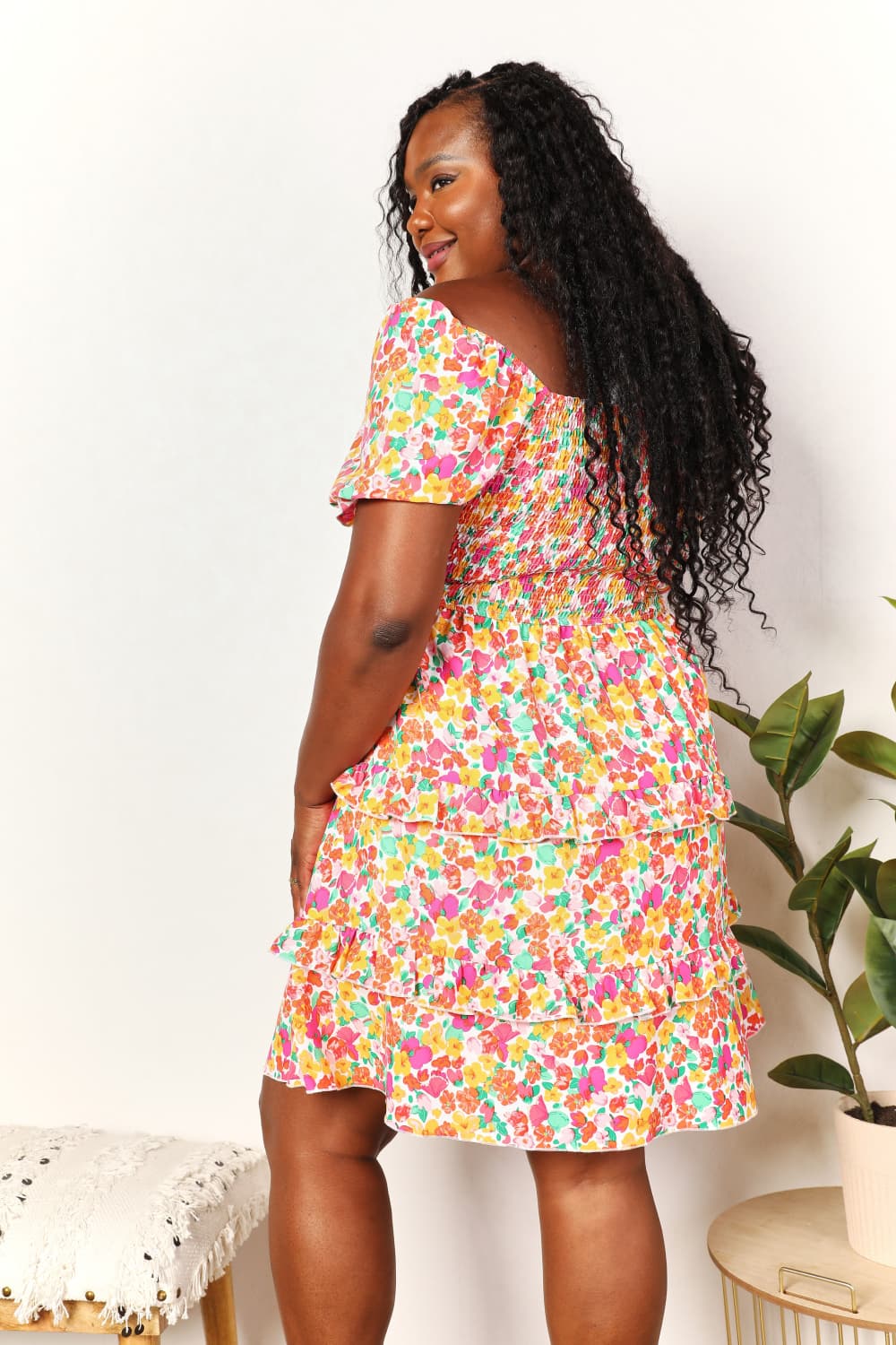 Colorful floral smocked mini dress with sweetheart neckline and tiered skirt