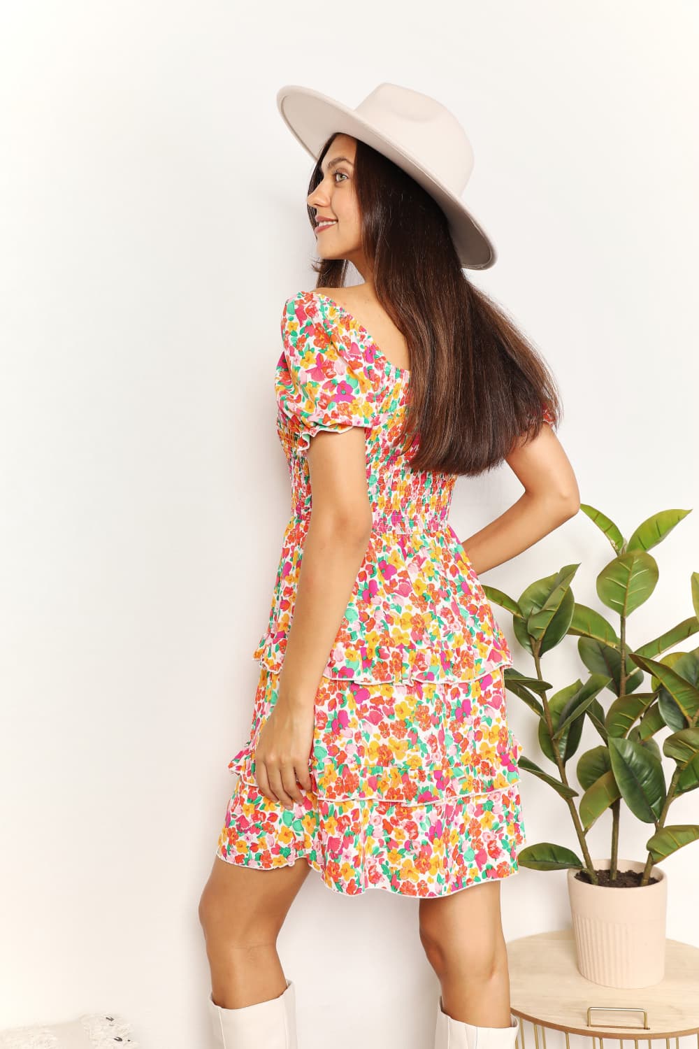 Colorful floral smocked mini dress with sweetheart neckline and tiered skirt