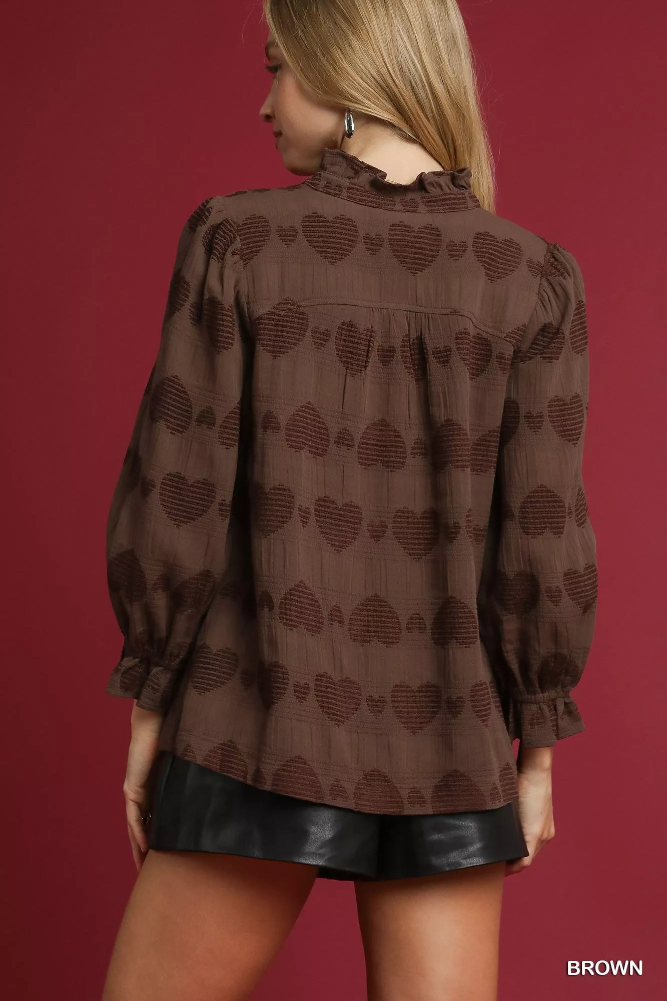 Model wearing brown heart jacquard ruffle trim Sweetheart Charm Ruffle Shirt.