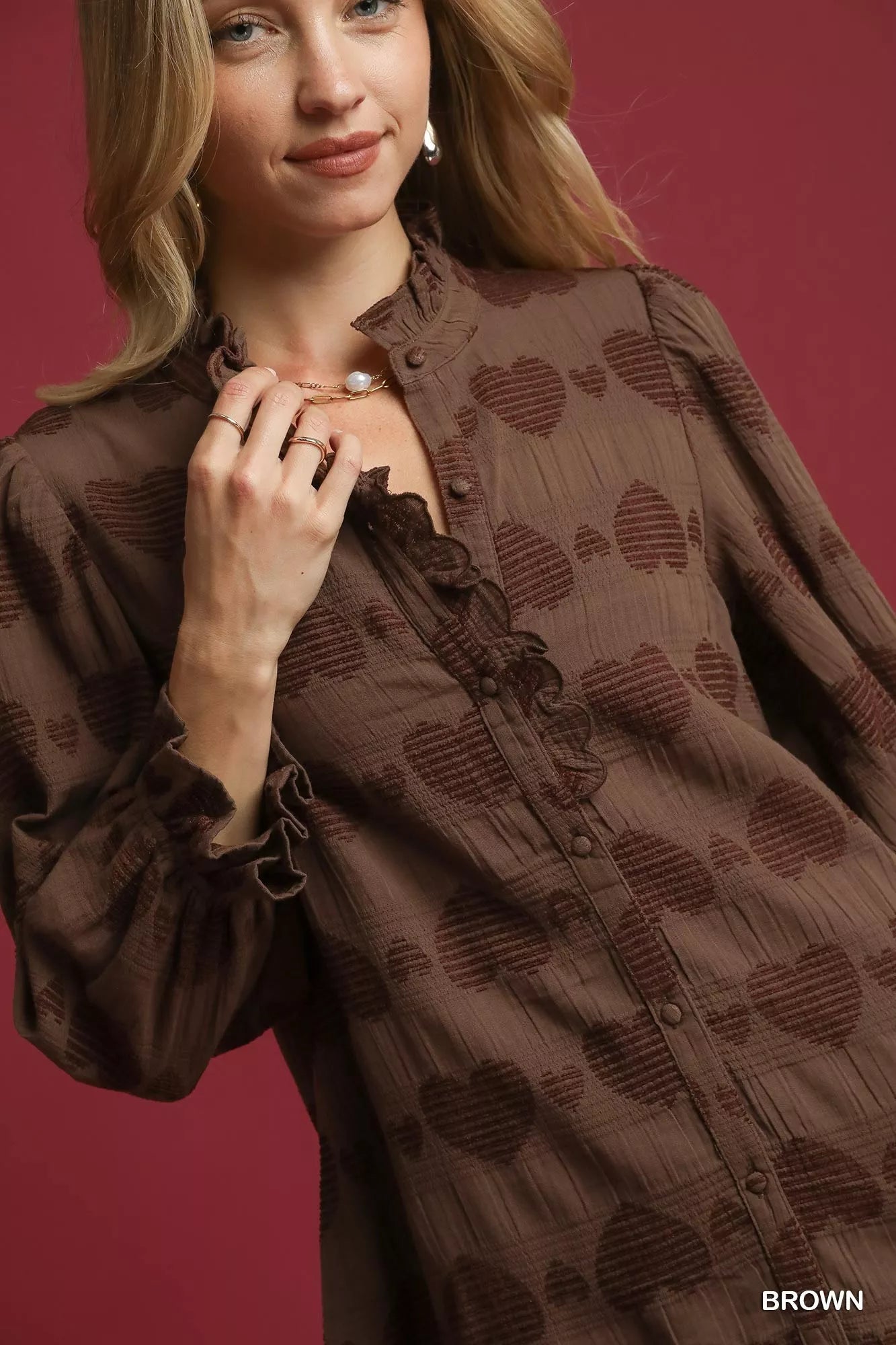 Model wearing brown heart jacquard ruffle trim Sweetheart Charm Ruffle Shirt.