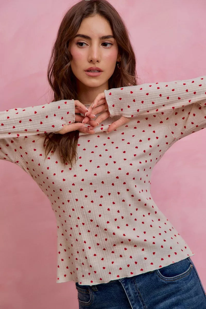 Cream ribbed knit long sleeve top with small red ditsy heart print