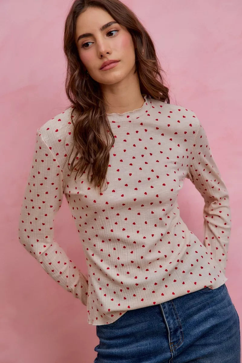Cream ribbed knit long sleeve top with small red ditsy heart print