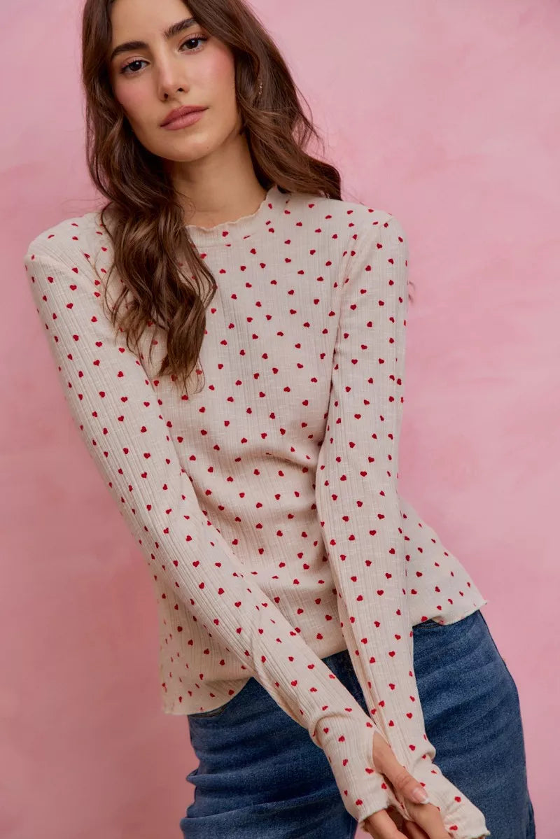 Cream ribbed knit long sleeve top with small red ditsy heart print