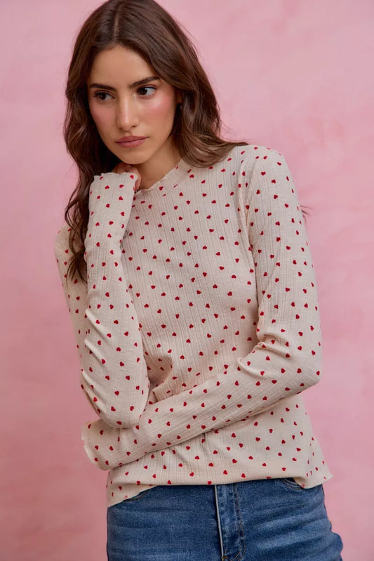 Cream ribbed knit long sleeve top with small red ditsy heart print