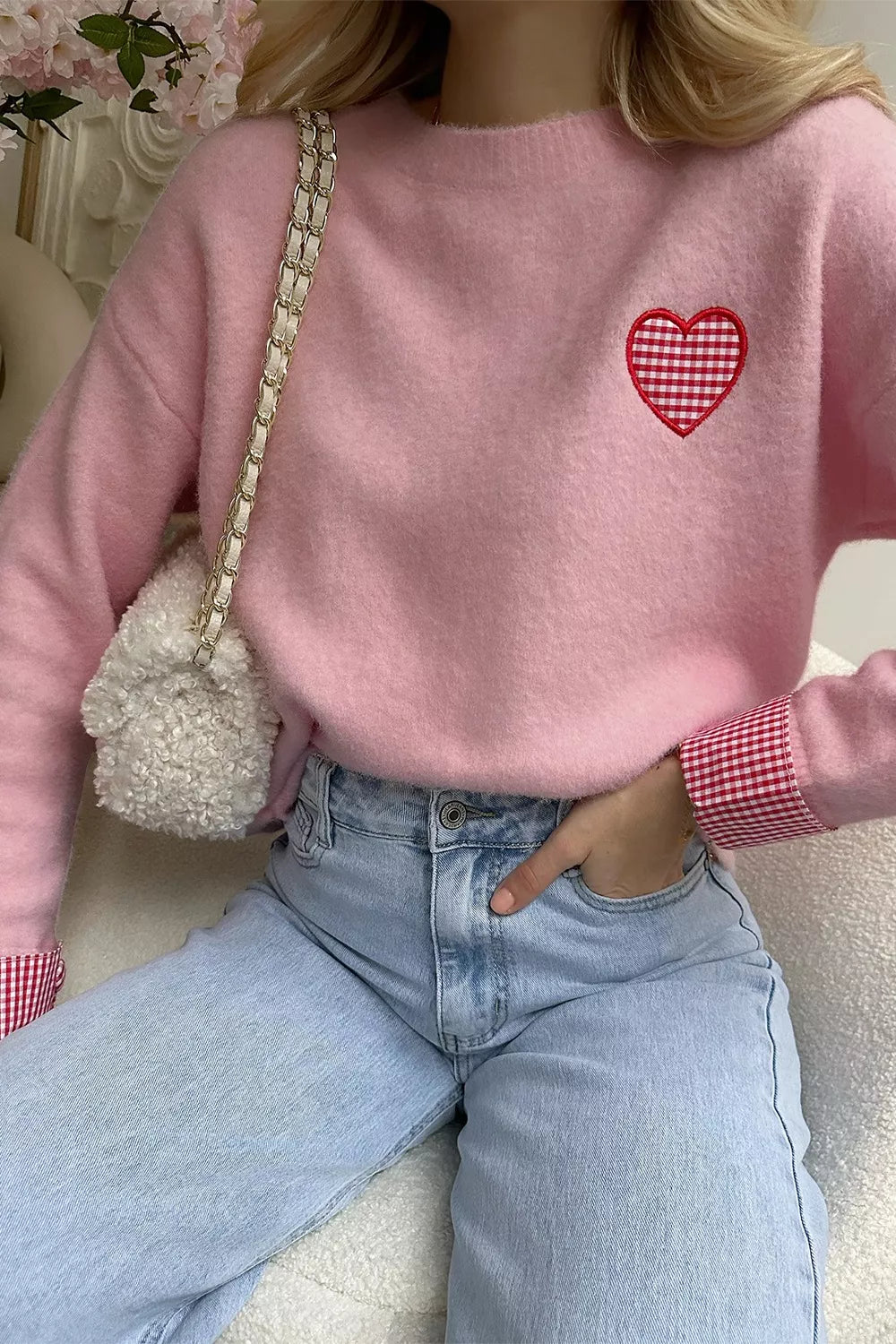 Blush pink knit sweater with embroidered gingham heart and gingham cuff details