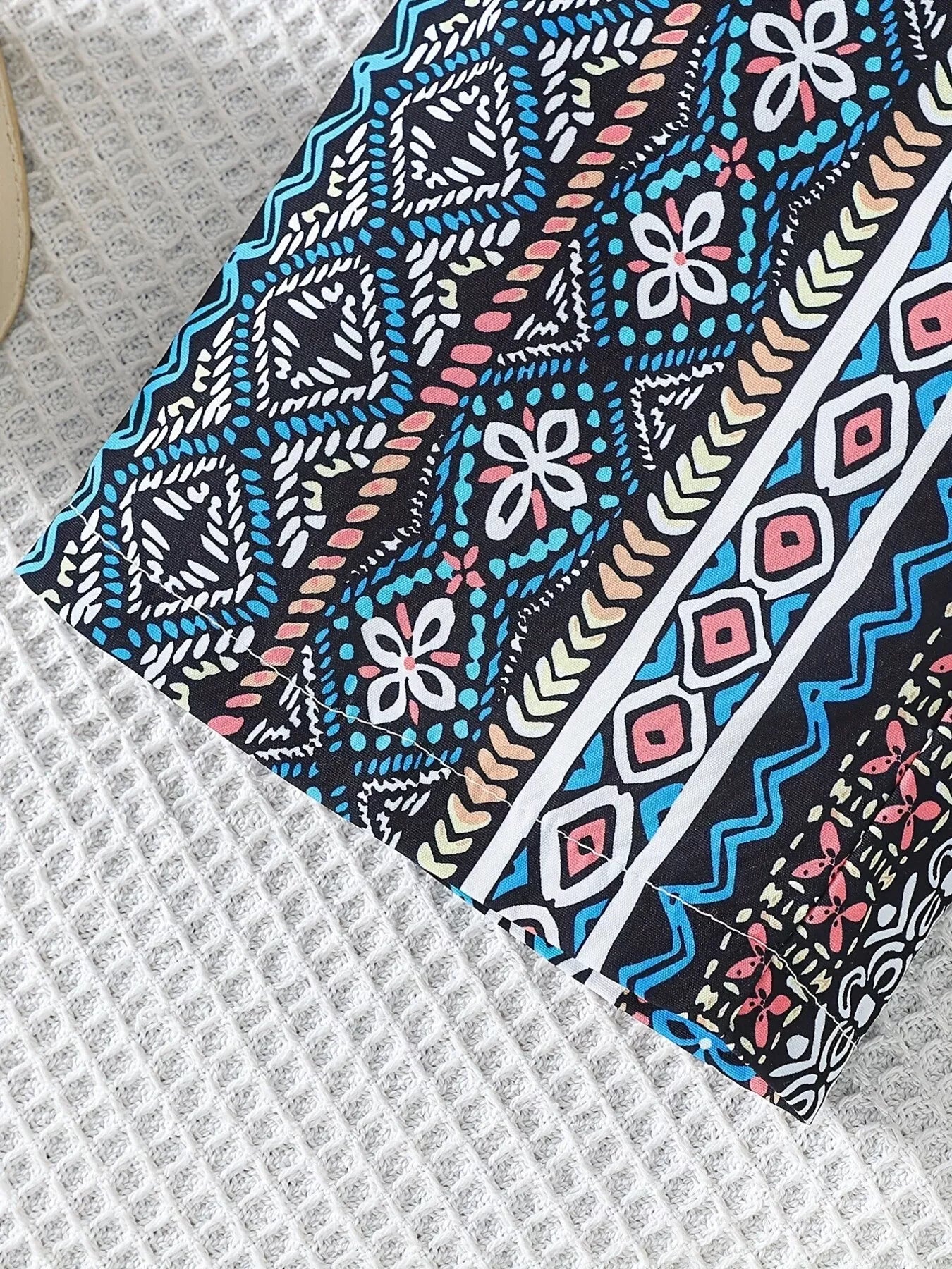 Children’s two-piece boho outfit with tassel crop top, printed wide-leg pants, pockets, and colorful summer styling.